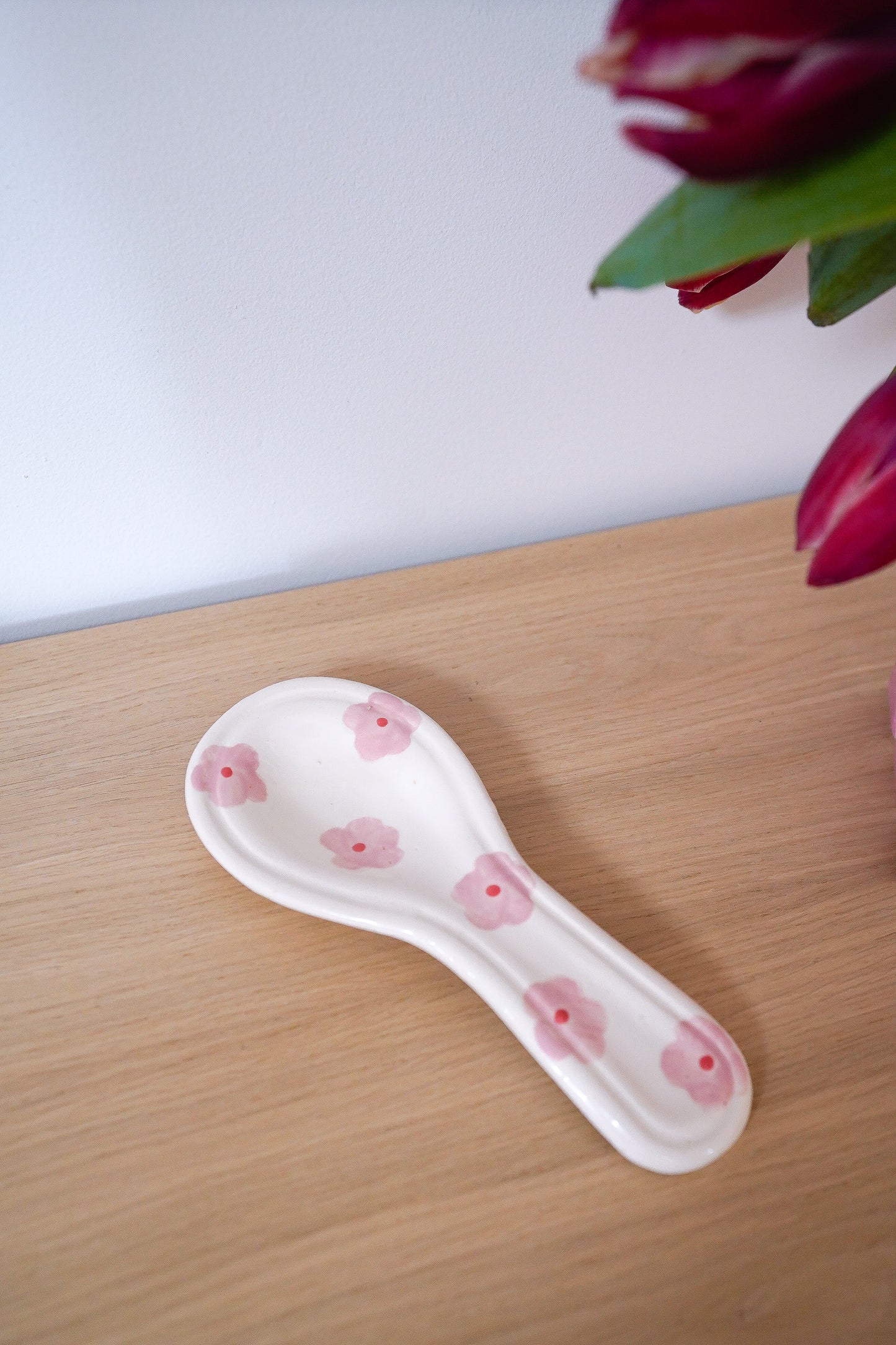 Repose-cuillère à fleurs
