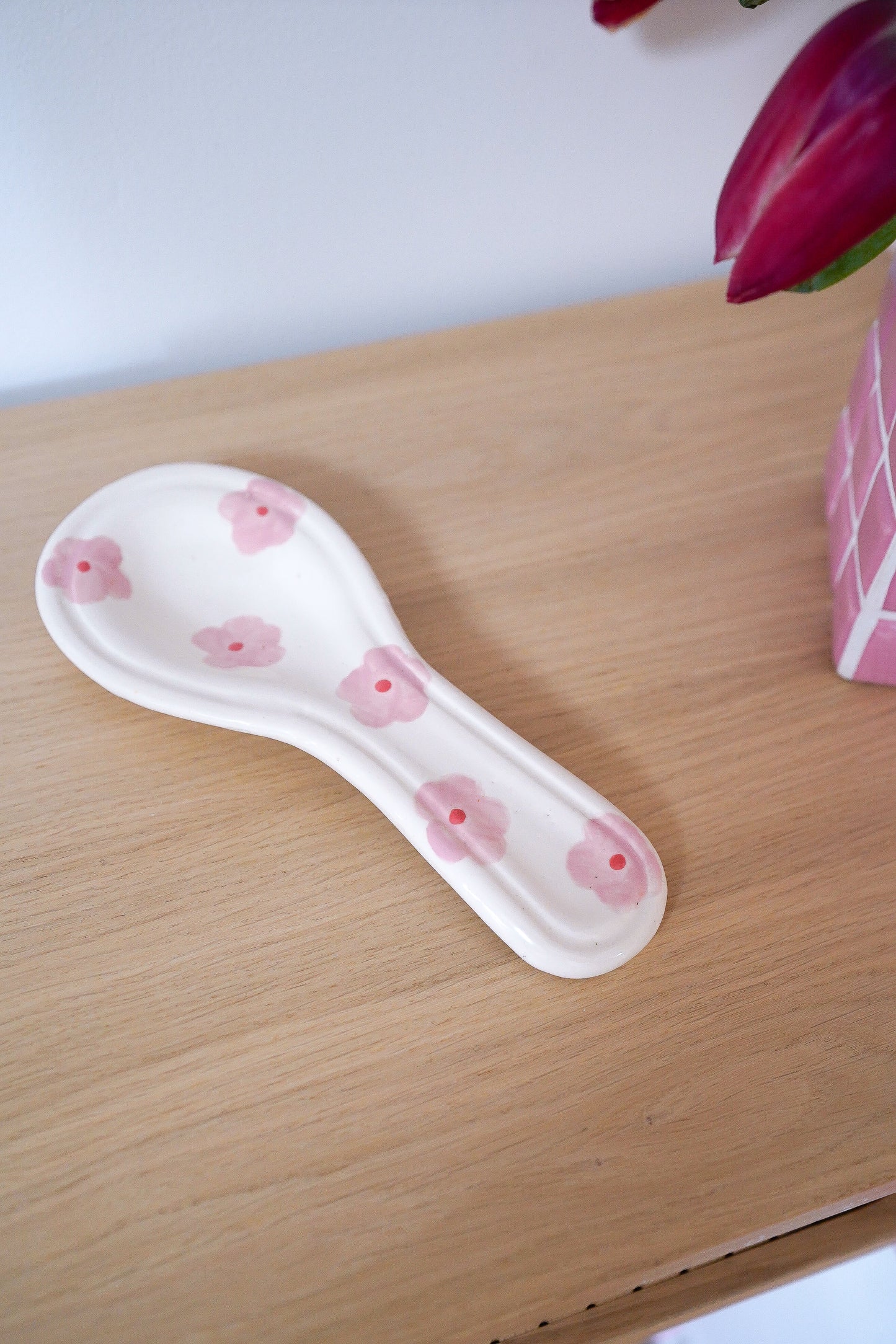 Repose-cuillère à fleurs