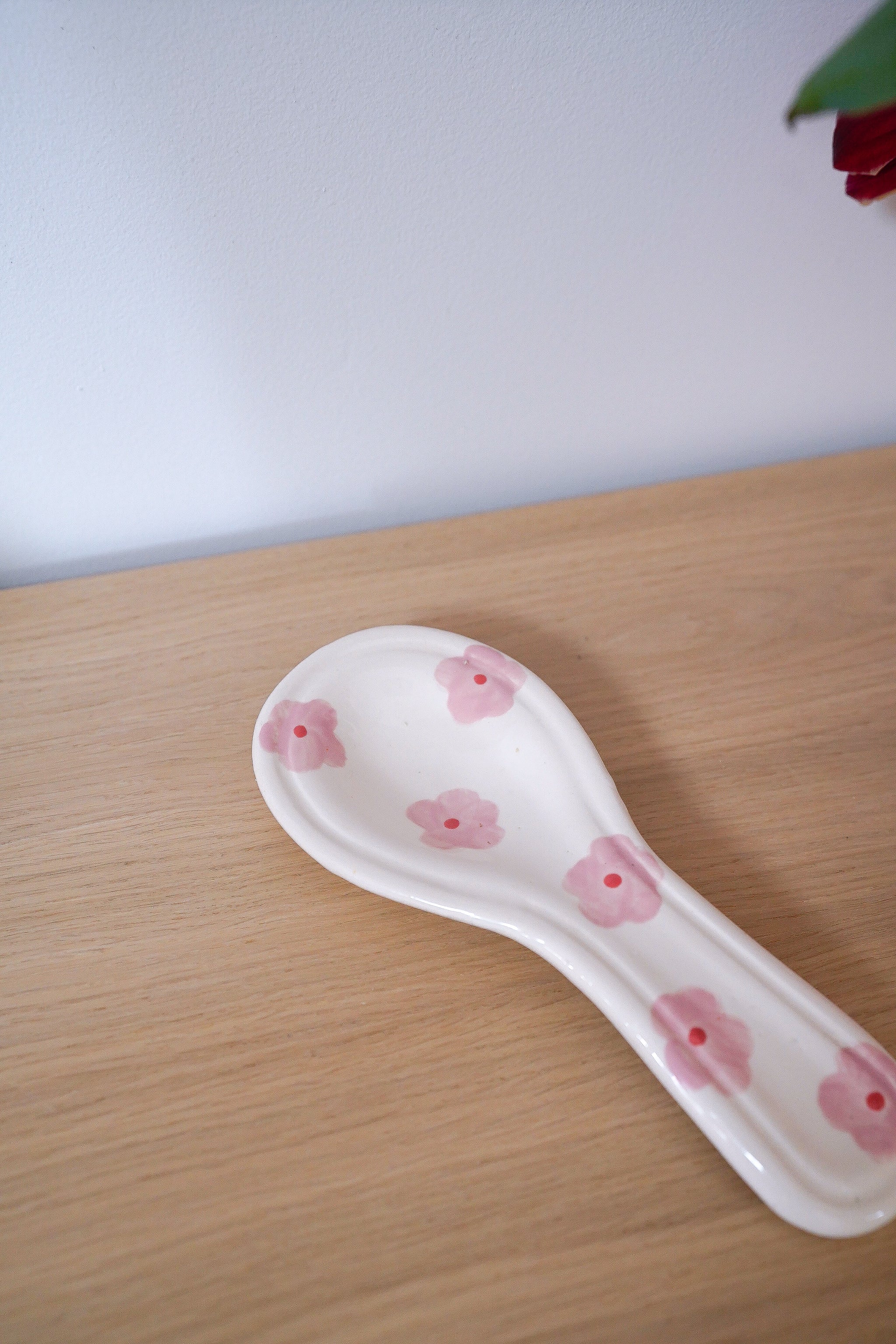 Repose-cuillère à fleurs