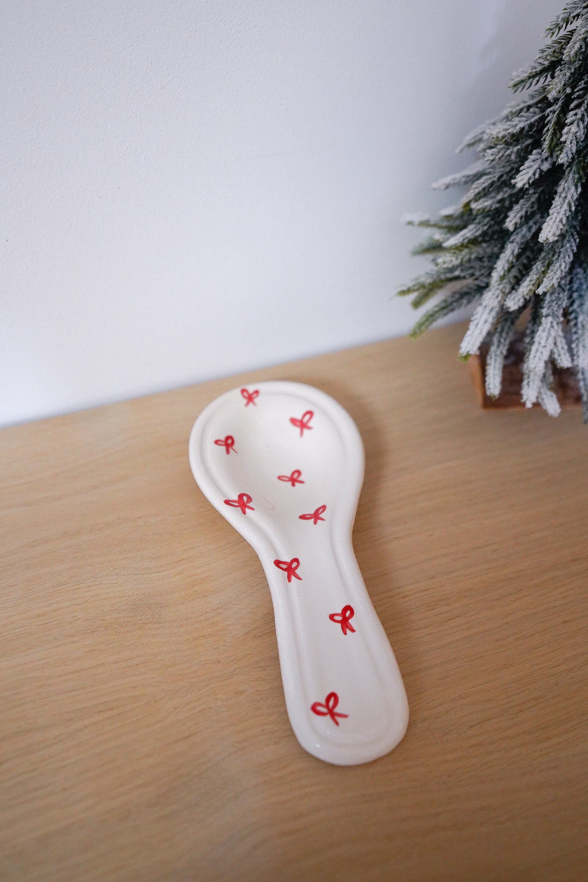 Repose-cuillère Noël nœuds rouges