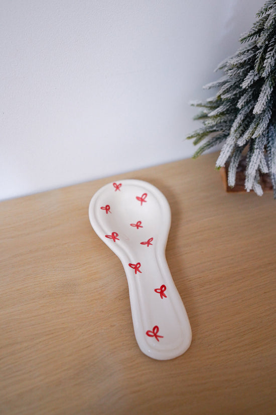 Repose-cuillère Noël nœuds rouges