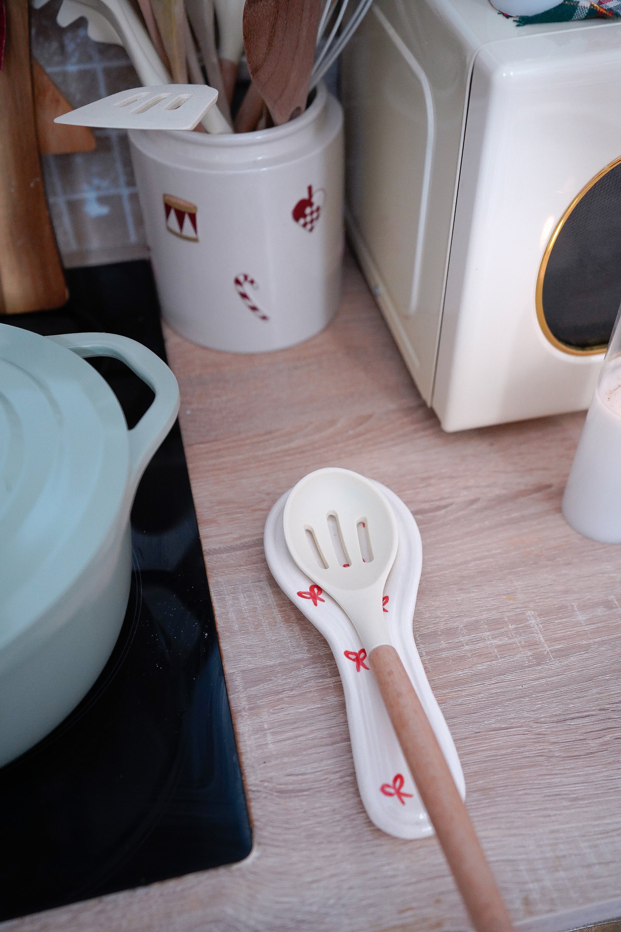 Repose-cuillère Noël nœuds rouges