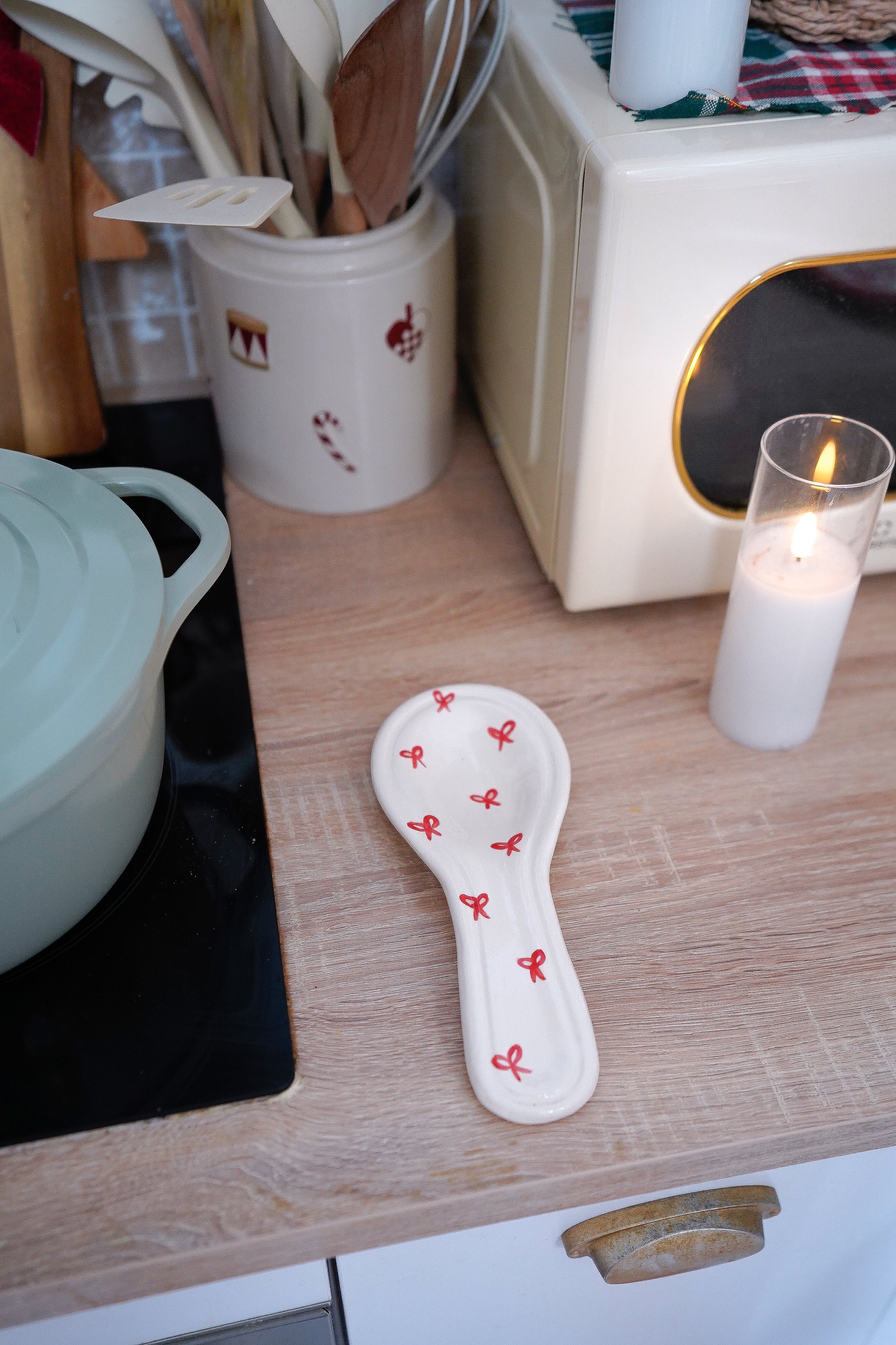 Repose-cuillère Noël nœuds rouges